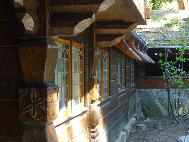 Courtyard facade with timber beams and carvings